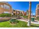 Exterior shot of buildings with picnic table, barbecue, grass, trees, and lush landscaping at 8101 W Flamingo Rd # 1035, Las Vegas, NV 89147