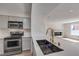 Well-equipped kitchen featuring stainless steel appliances and hardwood floors, perfect for cooking and entertaining at 8101 W Flamingo Rd # 1035, Las Vegas, NV 89147