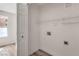 Laundry room featuring washer and dryer hookups and storage shelves at 8101 W Flamingo Rd # 1035, Las Vegas, NV 89147