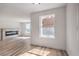 Bright living room and dining area featuring hardwood floors, natural light, and a modern fireplace at 8101 W Flamingo Rd # 1035, Las Vegas, NV 89147