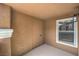 Covered patio featuring neutral tones, exterior storage, and natural light from the window at 8101 W Flamingo Rd # 1035, Las Vegas, NV 89147