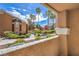 Balcony view of lush landscaping, palm trees, and well-maintained buildings at 8101 W Flamingo Rd # 1035, Las Vegas, NV 89147
