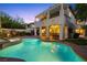 A tranquil backyard pool and patio create a luxurious outdoor living space, perfect for relaxation and entertaining at 820 Colina Alta Pl, Las Vegas, NV 89138