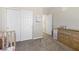 Bedroom with white closets, a dresser, and a soft carpet at 820 Colina Alta Pl, Las Vegas, NV 89138
