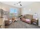 Adorable Bedroom with soft pink accents, a crib, and a comfortable armchair at 820 Colina Alta Pl, Las Vegas, NV 89138
