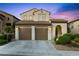 Charming two-story home with a two-car garage, desert landscaping, and a gated front entry at 820 Colina Alta Pl, Las Vegas, NV 89138