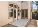 Exterior back view of home with doors leading to patio and backyard at 820 Colina Alta Pl, Las Vegas, NV 89138