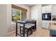 Eat-in kitchen area with a table set for four near a bright window view at 820 Colina Alta Pl, Las Vegas, NV 89138