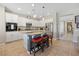 Bright kitchen with white cabinets, granite countertops, and a functional center island at 820 Colina Alta Pl, Las Vegas, NV 89138