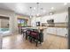 Charming kitchen featuring a kitchen island and an adjacent view of the backyard pool at 820 Colina Alta Pl, Las Vegas, NV 89138