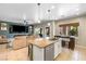 Open floor plan with kitchen island transitioning to a living room and patio at 820 Colina Alta Pl, Las Vegas, NV 89138