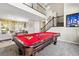 Open-concept living space with a pool table and staircase at 820 Colina Alta Pl, Las Vegas, NV 89138
