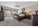 Serene main bedroom featuring a private balcony and elegant furniture, creating a luxurious retreat at 820 Colina Alta Pl, Las Vegas, NV 89138