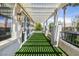 Covered patio with artificial turf and views of the surrounding neighborhood at 820 Colina Alta Pl, Las Vegas, NV 89138