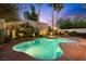Desert backyard oasis featuring a pool, spa, desert landscaping and an oversized patio at 820 Colina Alta Pl, Las Vegas, NV 89138