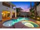 Backyard oasis featuring a pool, spa, desert landscaping, patio, and exterior dining at 820 Colina Alta Pl, Las Vegas, NV 89138