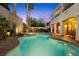 Inviting backyard pool and spa with desert landscaping, covered patio, and a two story home at 820 Colina Alta Pl, Las Vegas, NV 89138