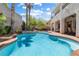 Inviting backyard with a sparkling pool, spa, and comfortable lounge seating at 820 Colina Alta Pl, Las Vegas, NV 89138