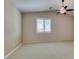 This bedroom features neutral paint, plush carpet, a ceiling fan, and a window with shutters at 8204 Turbys Treehouse Pl, Las Vegas, NV 89131