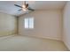 A cozy bedroom has neutral paint, plush carpet, and a window with white shutters at 8204 Turbys Treehouse Pl, Las Vegas, NV 89131
