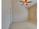 This bedroom boasts plush carpet, neutral paint, a ceiling fan, and a closet at 8204 Turbys Treehouse Pl, Las Vegas, NV 89131