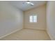 This cozy bedroom features neutral paint, plush carpet, and a window with white shutters at 8204 Turbys Treehouse Pl, Las Vegas, NV 89131