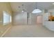 Open-concept living room with recessed lighting, carpet flooring, and views into the kitchen at 8204 Turbys Treehouse Pl, Las Vegas, NV 89131