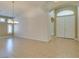 Spacious living room with ceramic tile flooring and double-door entry at 8204 Turbys Treehouse Pl, Las Vegas, NV 89131
