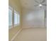 Corner view of living room with modern fan and white plantation shutters at 8204 Turbys Treehouse Pl, Las Vegas, NV 89131