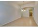 Spacious living room with ceramic tile flooring and a view of the kitchen at 8204 Turbys Treehouse Pl, Las Vegas, NV 89131