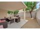 Backyard featuring a covered patio with outdoor seating and a grill at 8873 Happy Stream Ave, Las Vegas, NV 89143