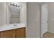 Bright bathroom vanity area with a sink and wood-tone cabinetry at 8873 Happy Stream Ave, Las Vegas, NV 89143