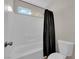 Bright bathroom featuring a tub shower, subway tile, and decorative shower curtain at 8873 Happy Stream Ave, Las Vegas, NV 89143