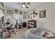 Charming bedroom features a ceiling fan, desk, and playful sports-themed decor at 8873 Happy Stream Ave, Las Vegas, NV 89143