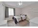 Cozy bedroom featuring neutral walls, plush carpeting, and ample natural light at 8873 Happy Stream Ave, Las Vegas, NV 89143