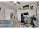 Inviting bedroom with a beanbag chair and workspace, illuminated by natural light at 8873 Happy Stream Ave, Las Vegas, NV 89143