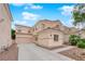 Spacious two-story house with a two car garage and xeriscape front yard at 8873 Happy Stream Ave, Las Vegas, NV 89143