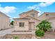 Charming two-story home with stucco exterior, tile roof, and well-maintained landscaping at 8873 Happy Stream Ave, Las Vegas, NV 89143