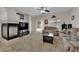Inviting living room featuring a fireplace and sliding glass doors to the outdoor area at 8873 Happy Stream Ave, Las Vegas, NV 89143