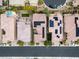 Aerial view of residences showcasing tile roofs, solar panels, landscaping, and community parking at 9496 Wild Valley Ave, Las Vegas, NV 89148