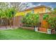 Beautiful backyard with artificial turf, a charming water feature, lush landscaping, and relaxing outdoor space at 9496 Wild Valley Ave, Las Vegas, NV 89148