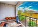 Charming balcony with decorative pots, railing, stylish outdoor rug, and scenic neighborhood views at 9496 Wild Valley Ave, Las Vegas, NV 89148