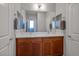 Bathroom features dual sinks, a large mirror, and stylish fixtures at 9496 Wild Valley Ave, Las Vegas, NV 89148