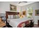 Comfortable bedroom with a large bed, ceiling fan, and natural light from the window at 9496 Wild Valley Ave, Las Vegas, NV 89148