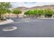 Gated community entrance with desert landscaping and mountain views at 9496 Wild Valley Ave, Las Vegas, NV 89148