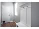 This entryway features wood-look flooring, a bench with coat hooks, and a pet door on the front door at 9496 Wild Valley Ave, Las Vegas, NV 89148