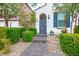 The front yard features stone pavers, desert landscaping, and a dark gray modern door at 9496 Wild Valley Ave, Las Vegas, NV 89148
