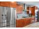 Modern kitchen features stainless steel appliances, granite countertops, and a decorative tile backsplash at 9496 Wild Valley Ave, Las Vegas, NV 89148