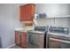 Modern laundry room features front-load washer/dryer set, cabinet storage, and convenient countertop space for folding and sorting at 9496 Wild Valley Ave, Las Vegas, NV 89148