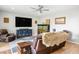 Inviting living room with leather recliners, a large television, and a unique aquarium at 9496 Wild Valley Ave, Las Vegas, NV 89148